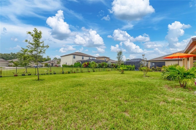 view of yard with fence and a residential view