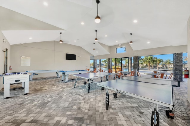 game room with recessed lighting, high vaulted ceiling, brick floor, and a ceiling fan