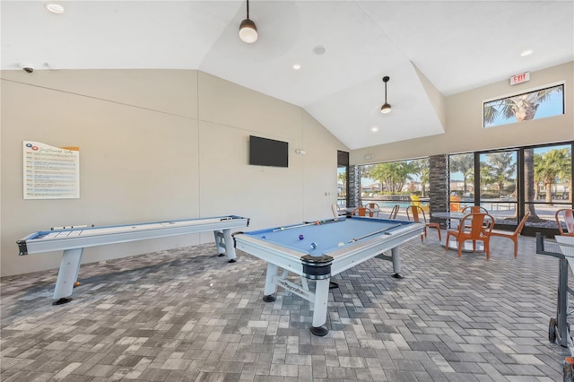 playroom featuring high vaulted ceiling