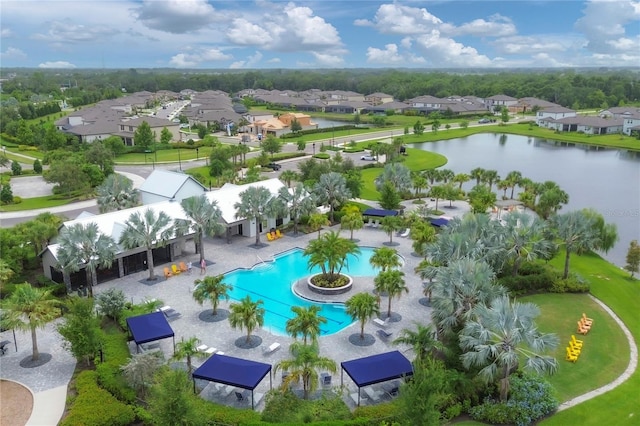 drone / aerial view with a residential view and a water view