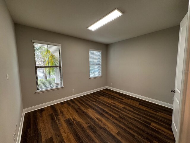 empty room featuring dark hardwood / wood-style floors