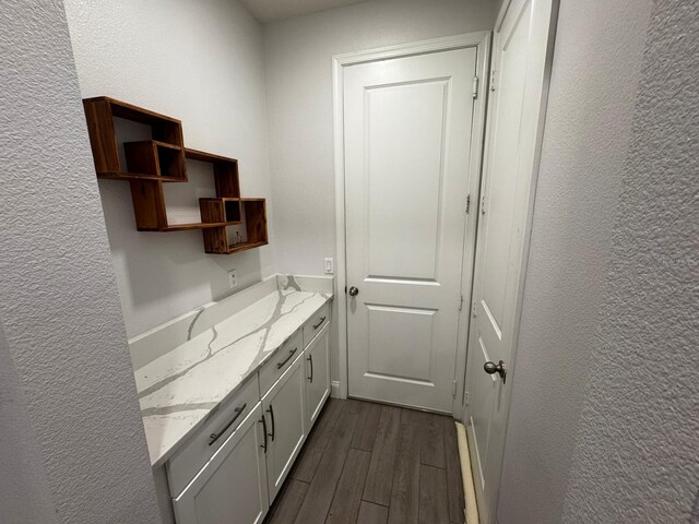 interior space featuring vanity and hardwood / wood-style floors