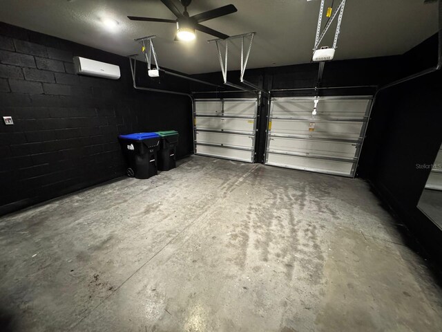 garage featuring a wall mounted air conditioner and a garage door opener