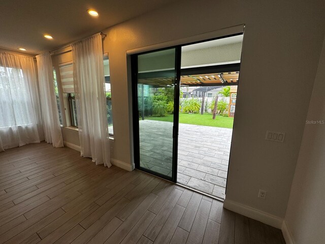 doorway to outside featuring hardwood / wood-style floors