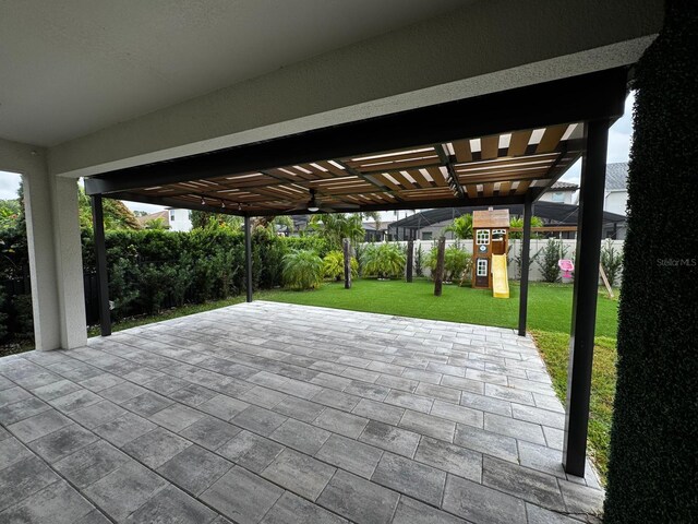 view of patio featuring a playground