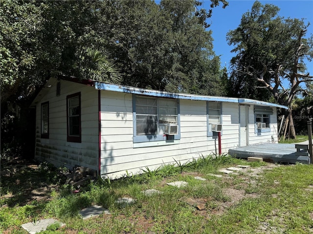 manufactured / mobile home featuring a deck and cooling unit