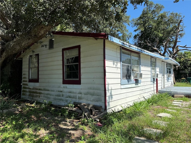 view of side of property featuring cooling unit