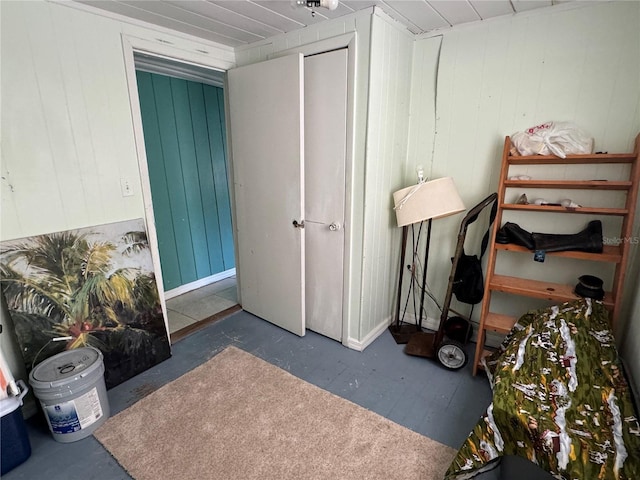 bedroom with wood walls