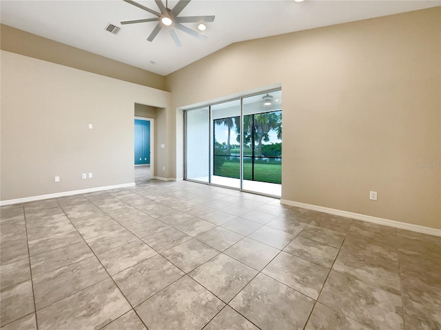 tiled spare room featuring ceiling fan and lofted ceiling