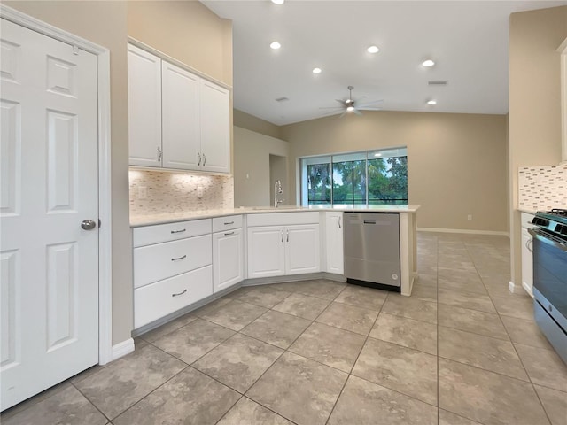 kitchen with kitchen peninsula, white cabinets, appliances with stainless steel finishes, ceiling fan, and sink