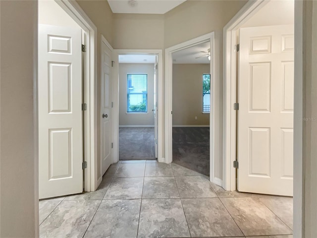 corridor with light colored carpet