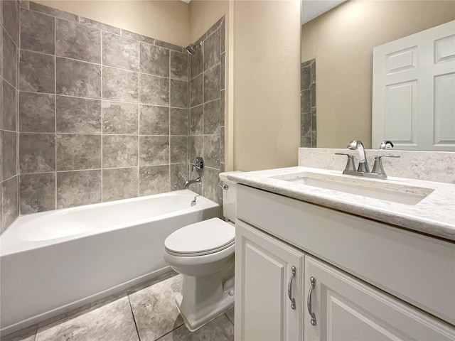 full bathroom featuring vanity, tile patterned flooring, tiled shower / bath combo, and toilet