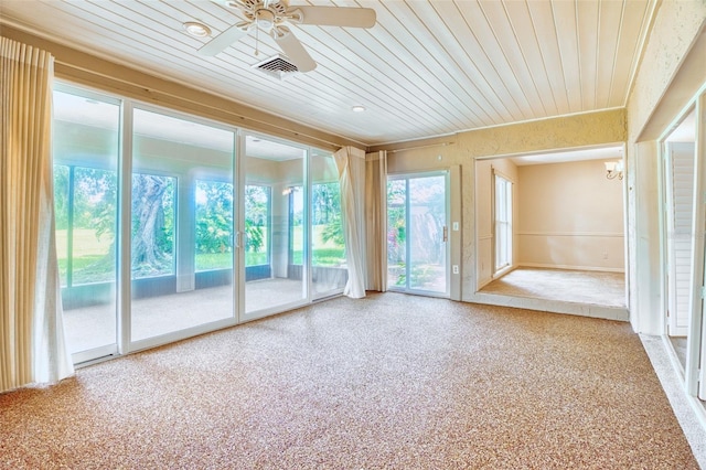 interior space featuring ceiling fan and wooden ceiling