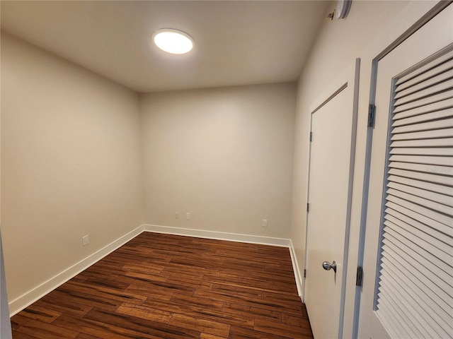 unfurnished room with dark hardwood / wood-style floors