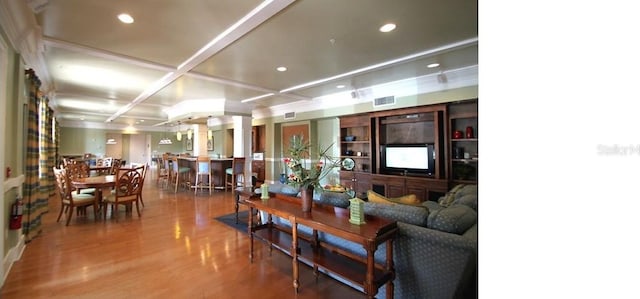 living room featuring hardwood / wood-style flooring and coffered ceiling