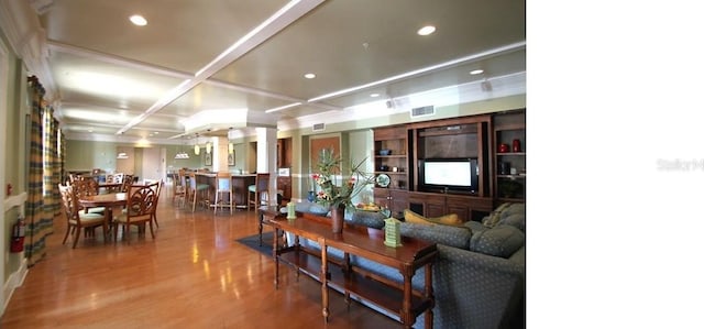 living area with visible vents, wood finished floors, recessed lighting, decorative columns, and coffered ceiling