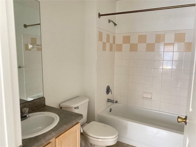 bathroom featuring bathtub / shower combination, toilet, and vanity