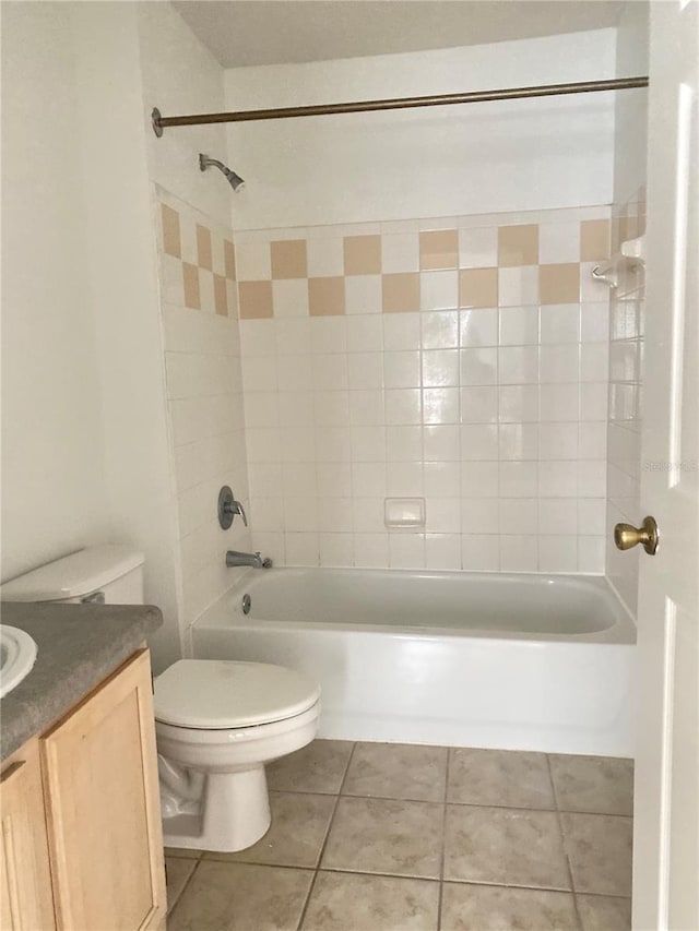 bathroom featuring tile patterned floors, vanity, shower / bathtub combination, and toilet