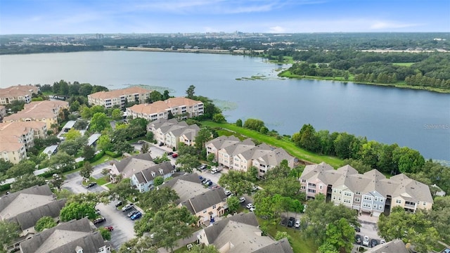 drone / aerial view featuring a residential view and a water view