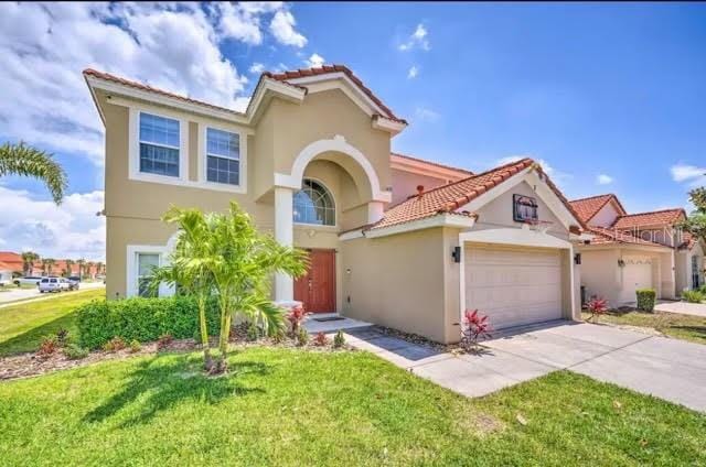 mediterranean / spanish-style home featuring a front lawn