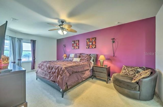 carpeted bedroom featuring ceiling fan