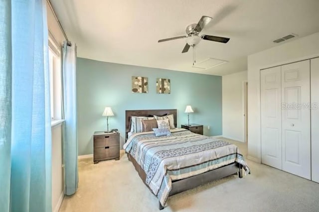 carpeted bedroom featuring a closet and ceiling fan