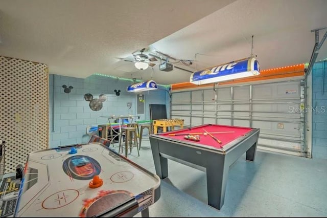 game room with billiards and a textured ceiling