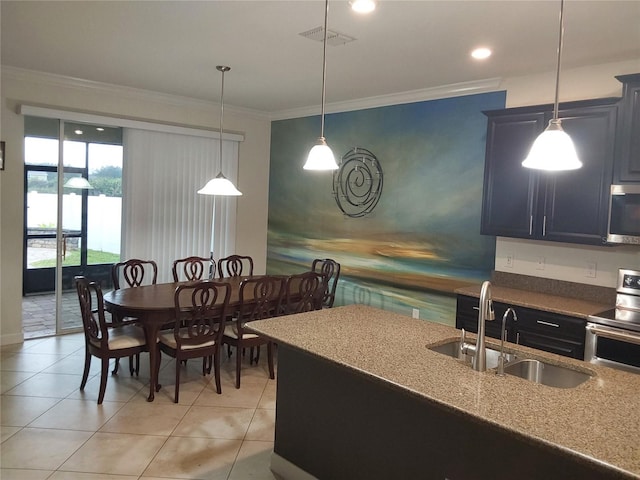 kitchen featuring crown molding, appliances with stainless steel finishes, sink, and light tile patterned floors