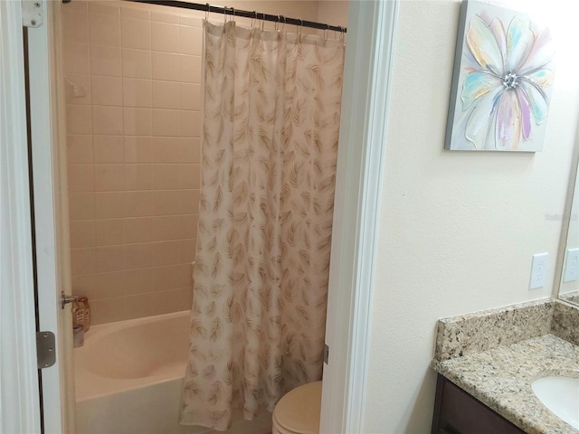 full bathroom featuring vanity, shower / bath combination with curtain, and toilet