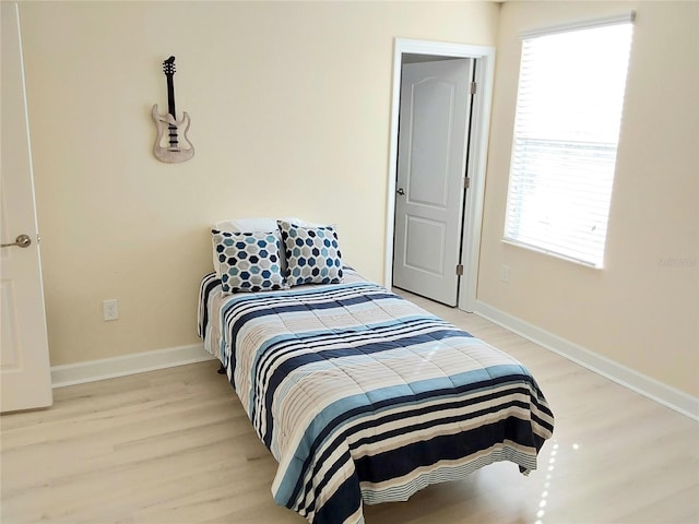 bedroom with light hardwood / wood-style floors