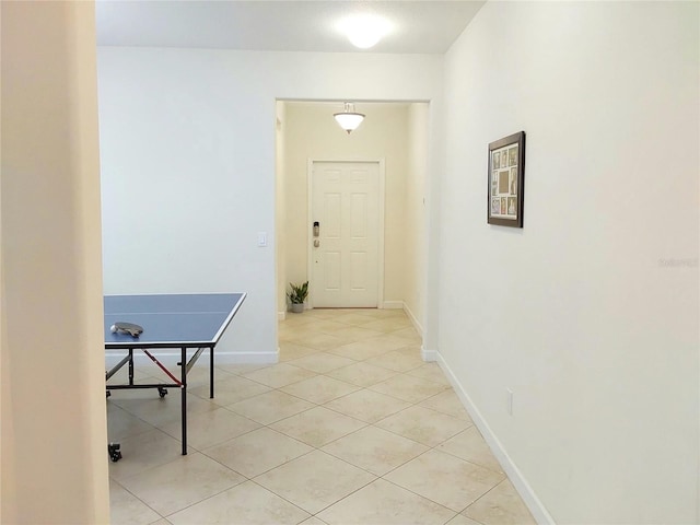 hall with light tile patterned flooring