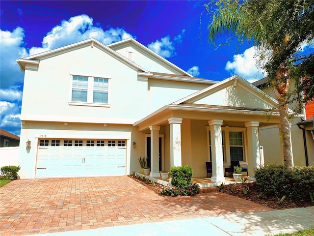 view of front of house featuring a garage and covered porch