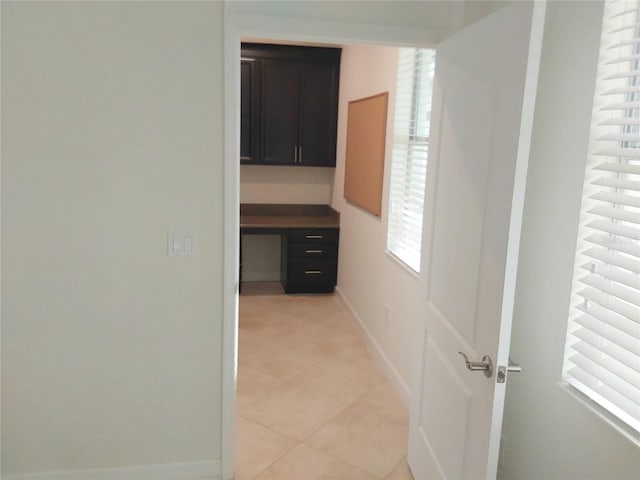 hallway with light tile patterned floors