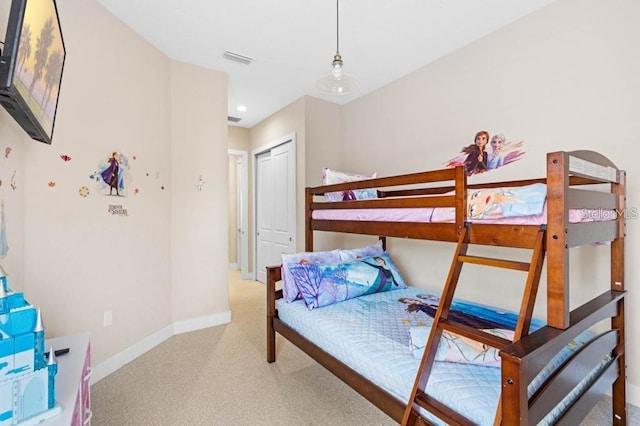 bedroom featuring a closet and carpet floors