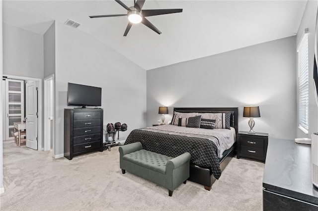 carpeted bedroom with high vaulted ceiling and ceiling fan