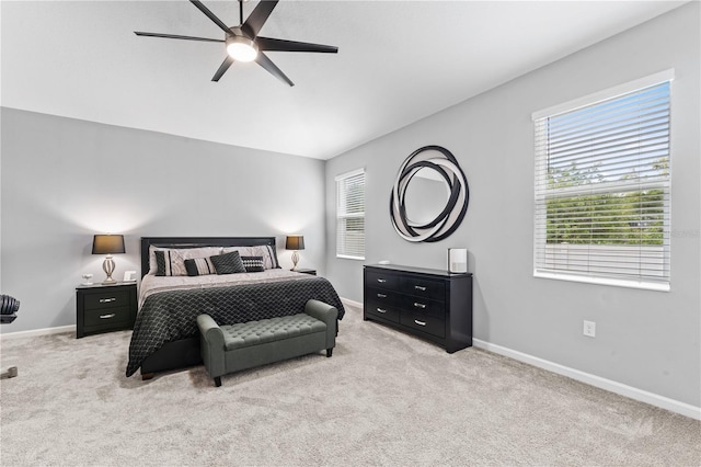 bedroom featuring ceiling fan and light colored carpet