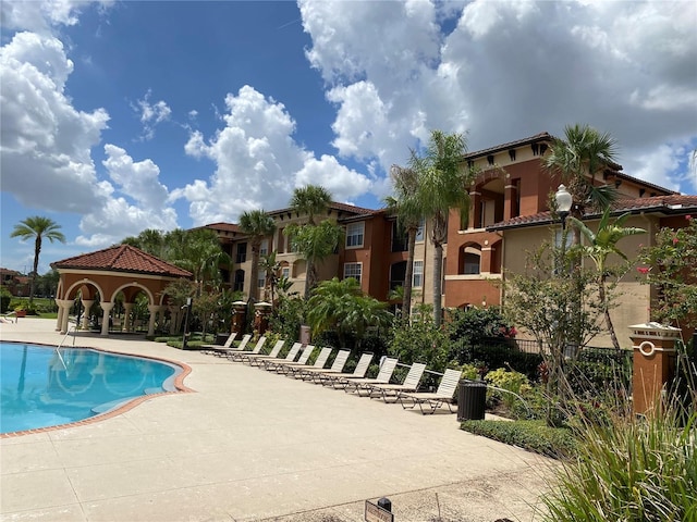 view of swimming pool with a gazebo and a patio area