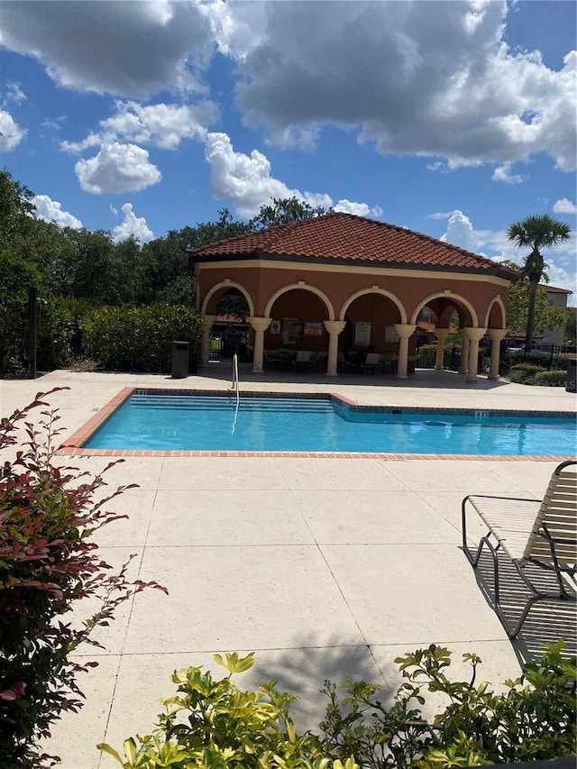 view of pool featuring a gazebo and a patio area