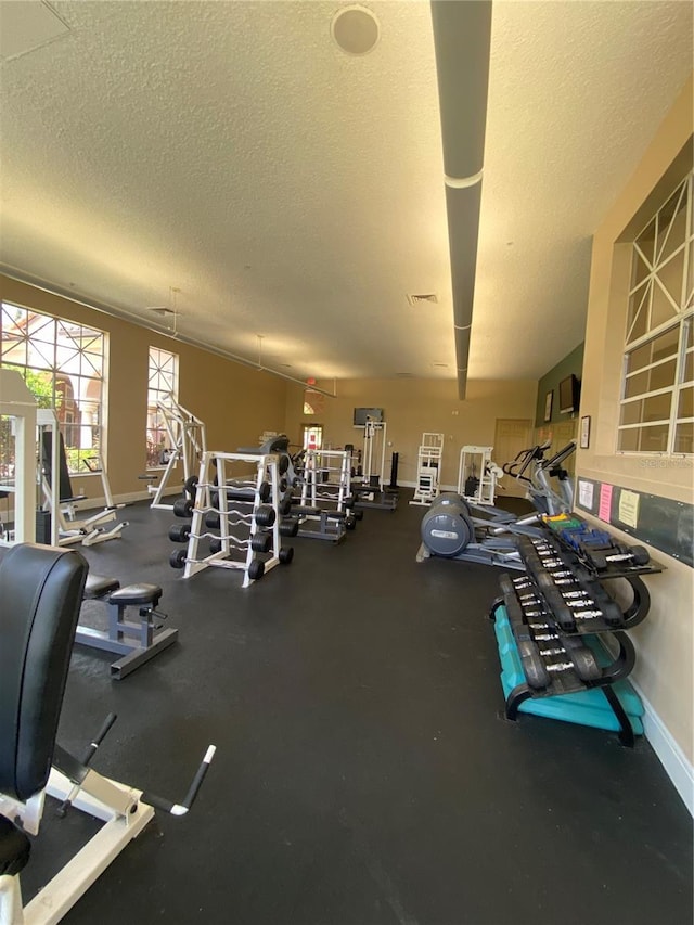 workout area featuring a textured ceiling