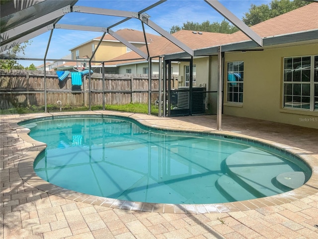 view of pool featuring a lanai and a patio area