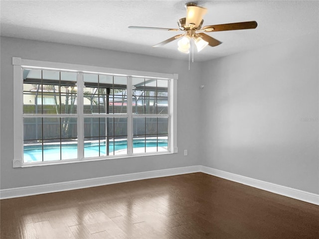 empty room featuring ceiling fan and hardwood / wood-style flooring