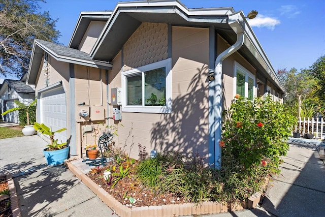 view of property exterior with a garage