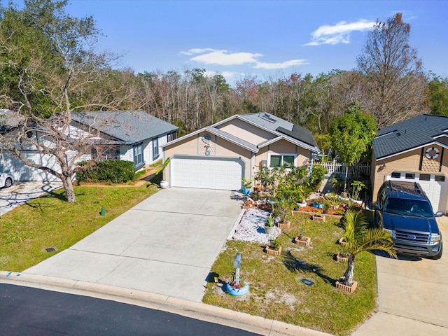 view of front of home with a garage and a front lawn