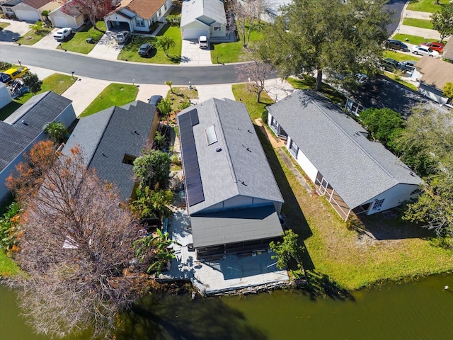 drone / aerial view with a water view