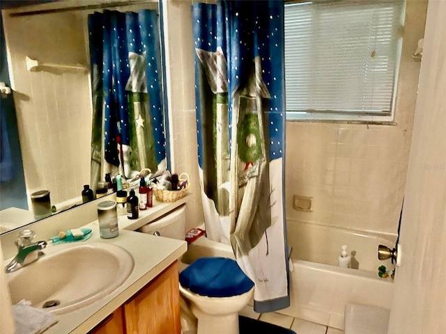 full bathroom featuring vanity, toilet, shower / bath combo with shower curtain, and tile patterned flooring