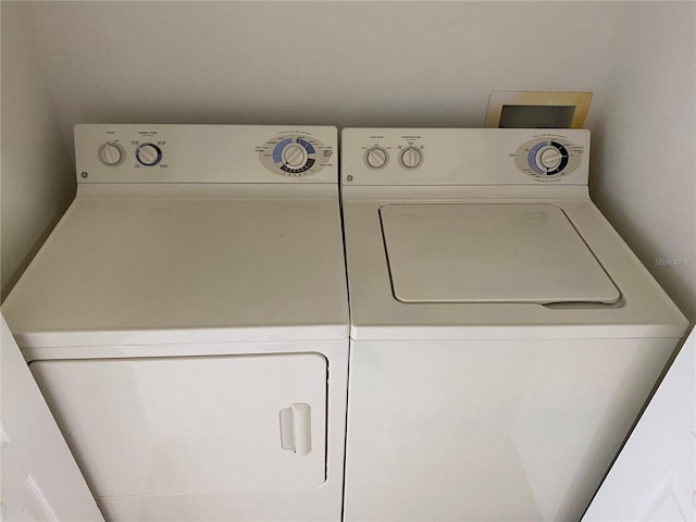 washroom with washer and dryer