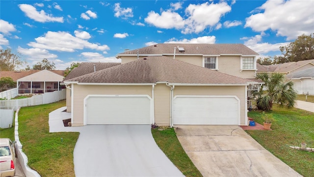 view of front of property with a garage and a front yard