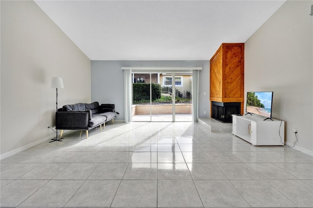 living room featuring a multi sided fireplace and light tile patterned floors