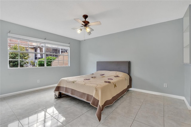 tiled bedroom with ceiling fan