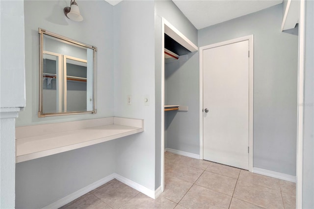 spacious closet featuring light tile patterned floors